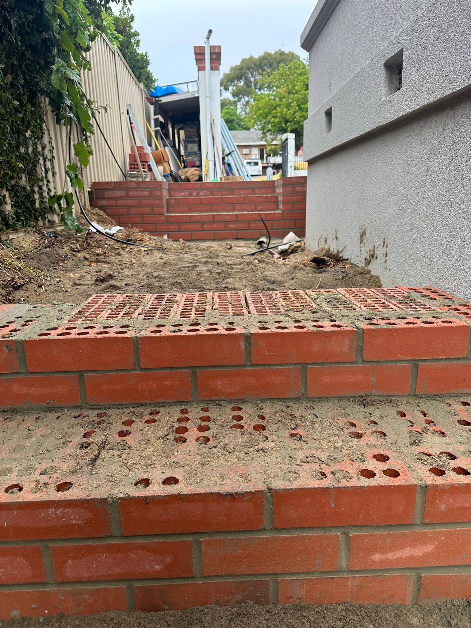 Close-up of the perforated brick step treads — Nedlands